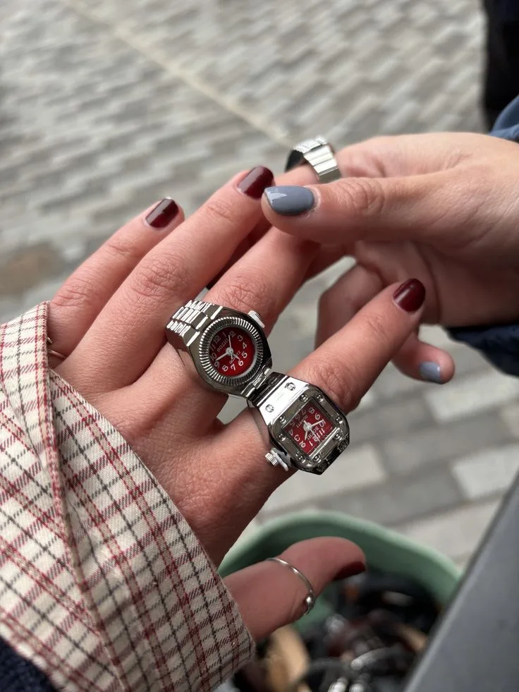 Silver ring watches with red dials