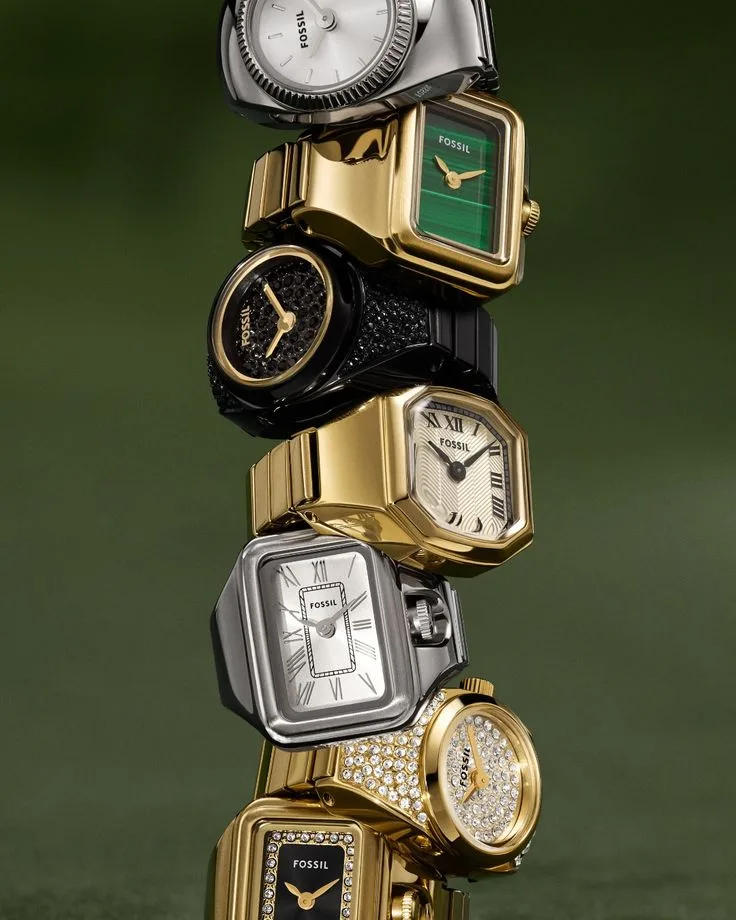 Stack of gold and silver ring watches